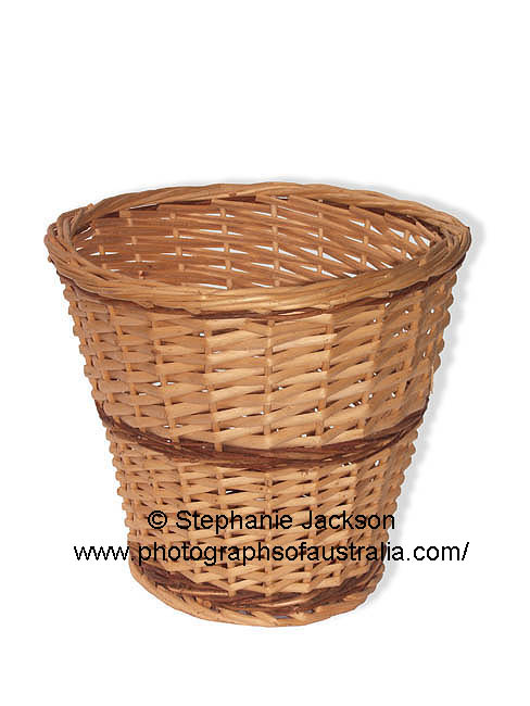 wicker waste paper basket on white background