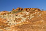 queensland outback landscpe with rocky hill and spinifex grass triodia