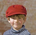 portrait of young boy wearing red cap