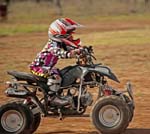 young bot three years old riding quad bike